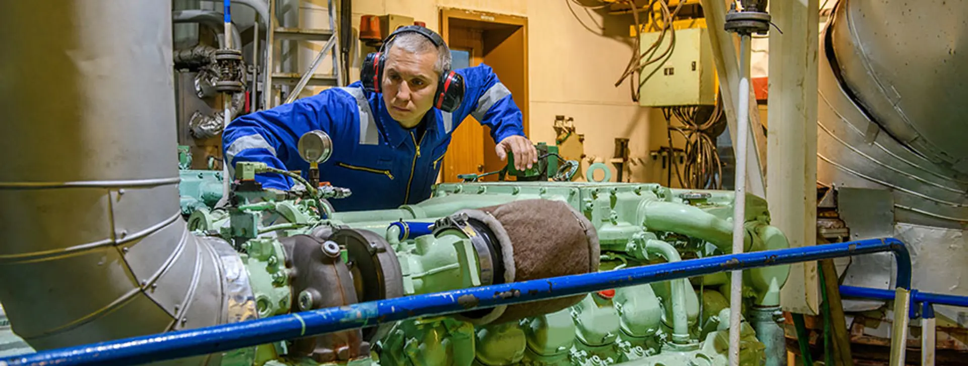 Engineer inspecting motor engine load